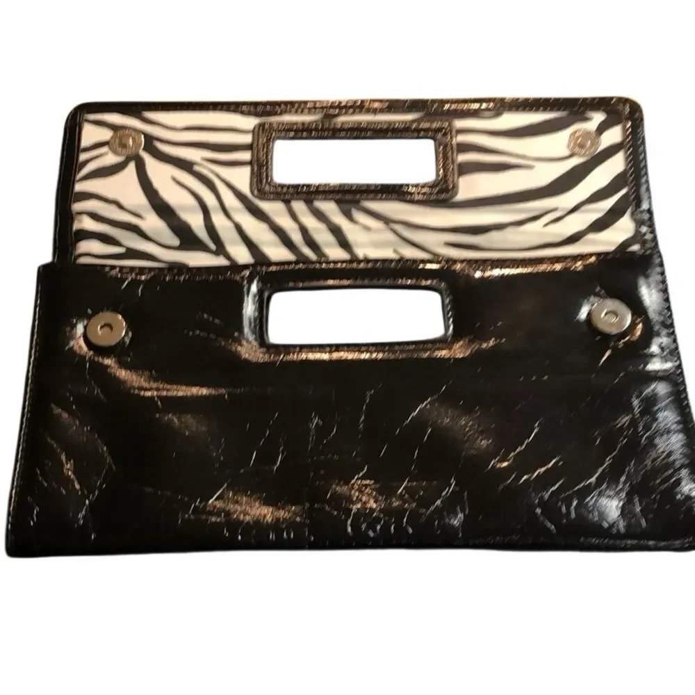 Gap black shiny clutch with zebra print inside